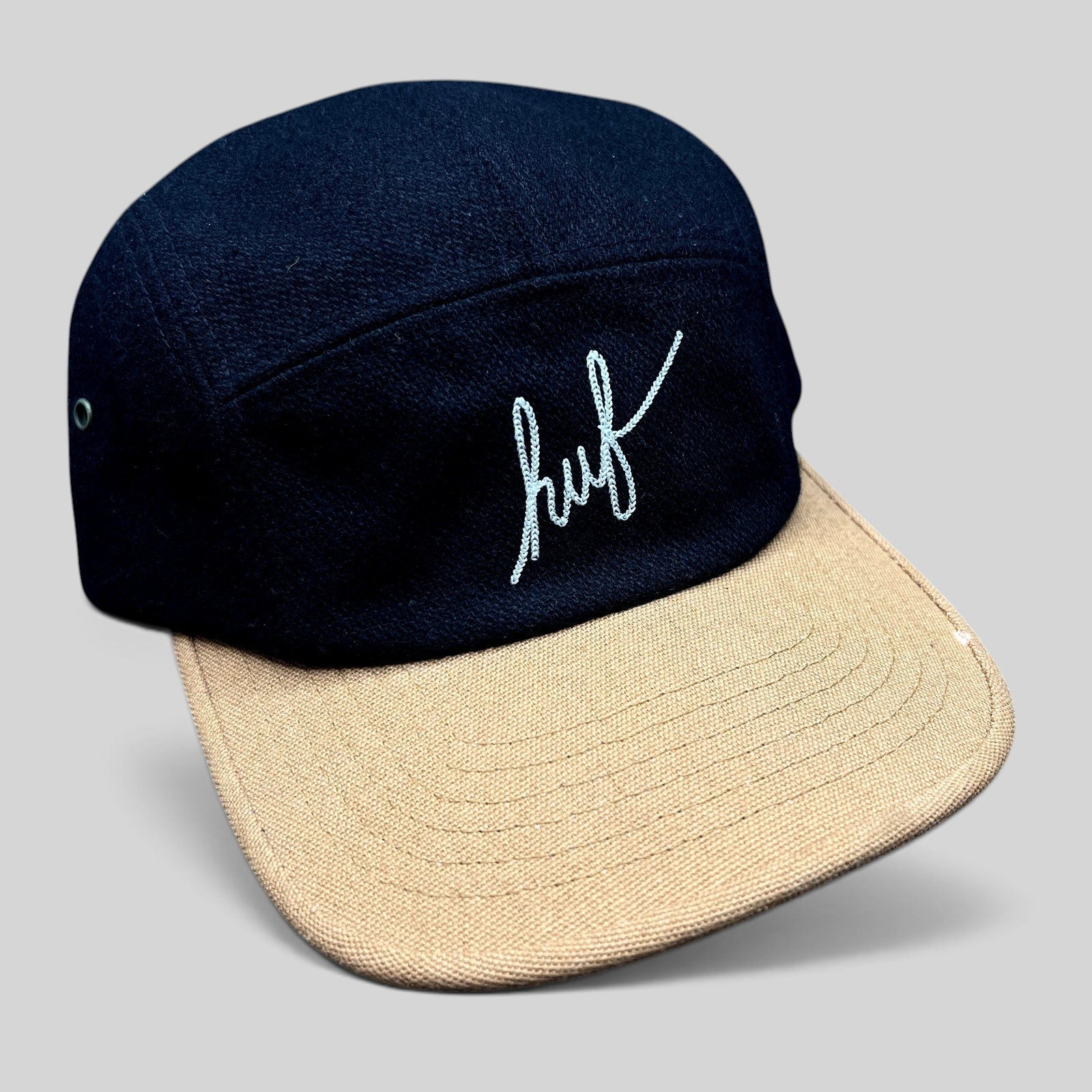 Raree Finds HUF black wool-style camp hat with a tan brim and white embroidered script logo on the front