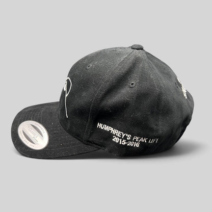 Raree Finds black Yupoong strapback hat with white Humphreys Peak Lift 2015-2016 embroidery on the side profile.