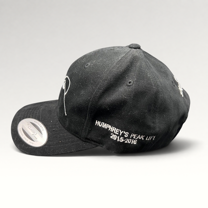 Raree Finds black Yupoong strapback hat with white Humphreys Peak Lift 2015-2016 embroidery on the side profile.