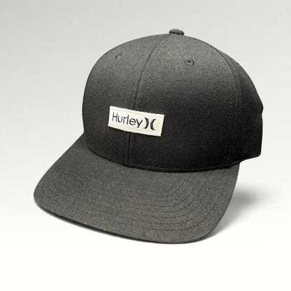 Raree Finds black Hurley snapback hat with a white woven logo patch on a structured Yupoong crown and flat brim