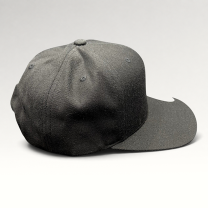 Raree Finds Hurley black Yupoong snapback hat with a structured crown and flat brim in a classic skate style.