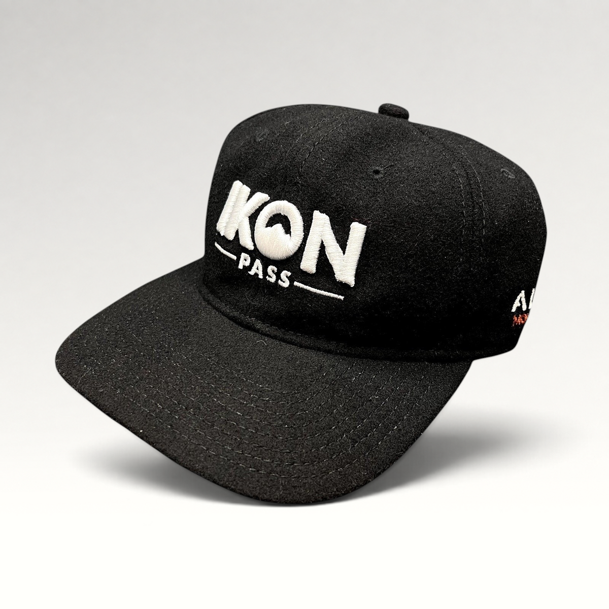 Raree Finds black wool-blend Ikon Pass strapback hat with white embroidered logo for skiing and snowboarding