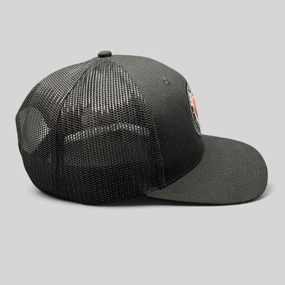 Raree Finds In-N-Out Burger Rock 2 Freedom black trucker hat with mesh back and graphic patch, side profile view.