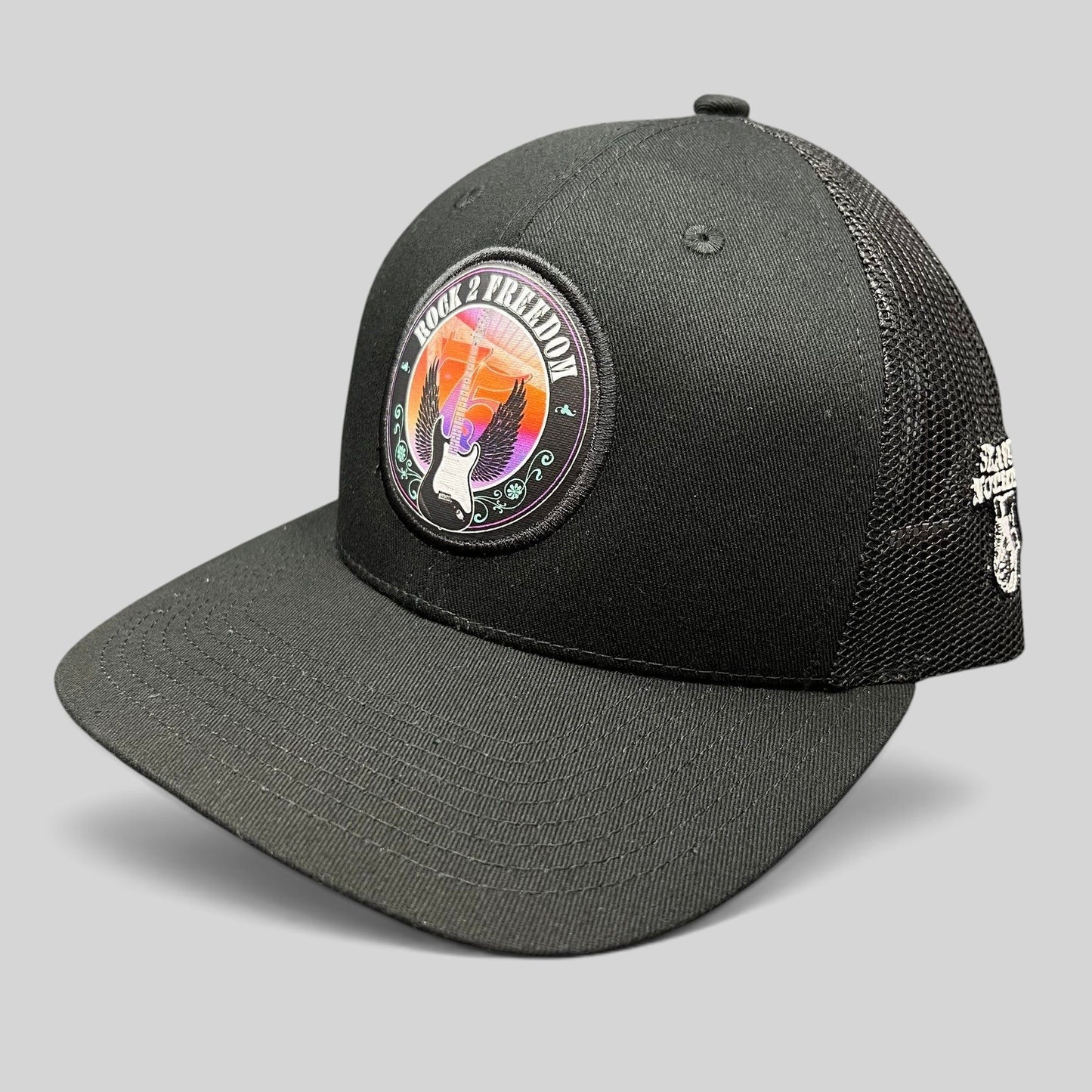 Raree Finds black In-N-Out Burger Rock 2 Freedom trucker hat with a vibrant winged guitar patch and mesh back.