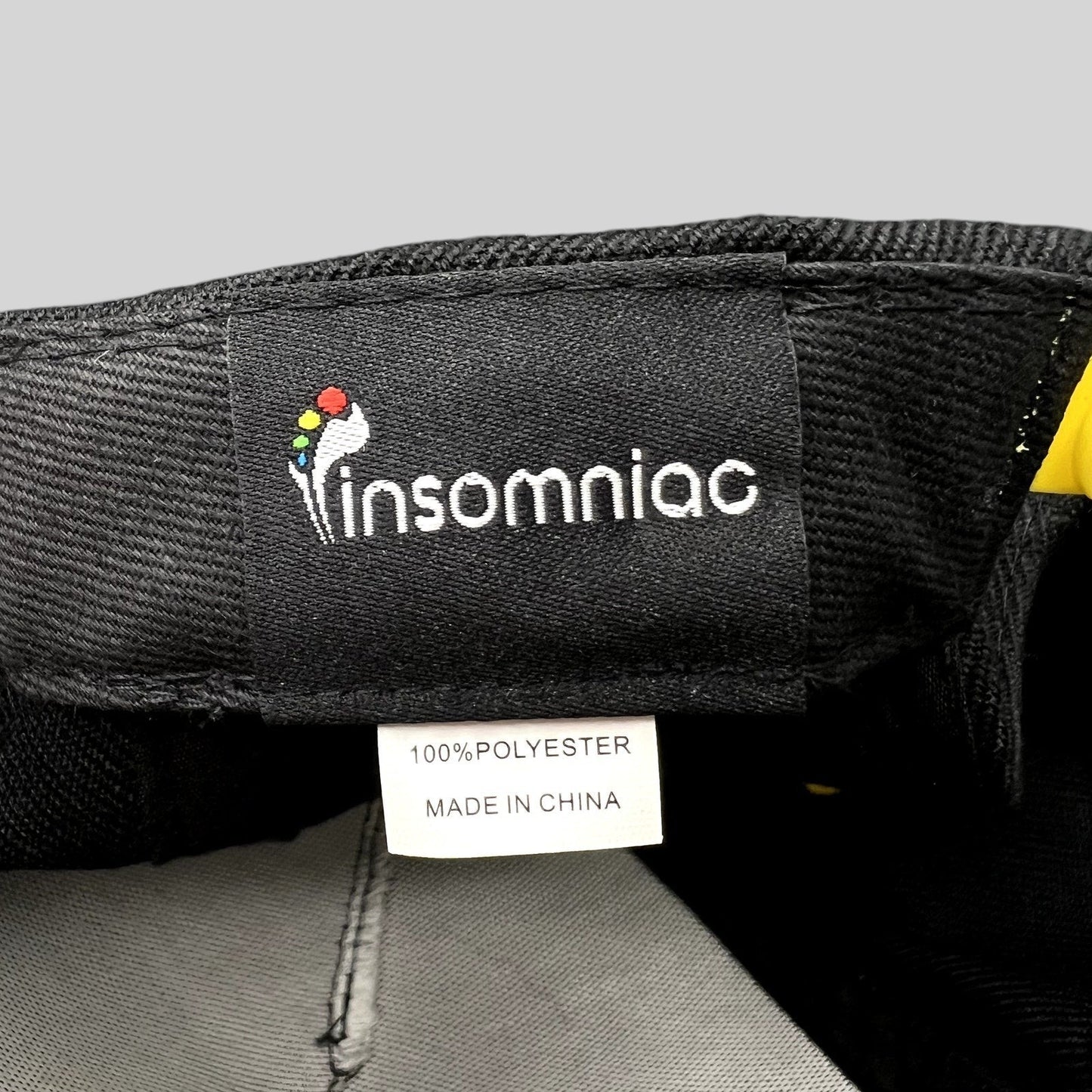 Raree Finds Insomniac EDC snapback interior label with owl logo and 100 percent polyester material tag