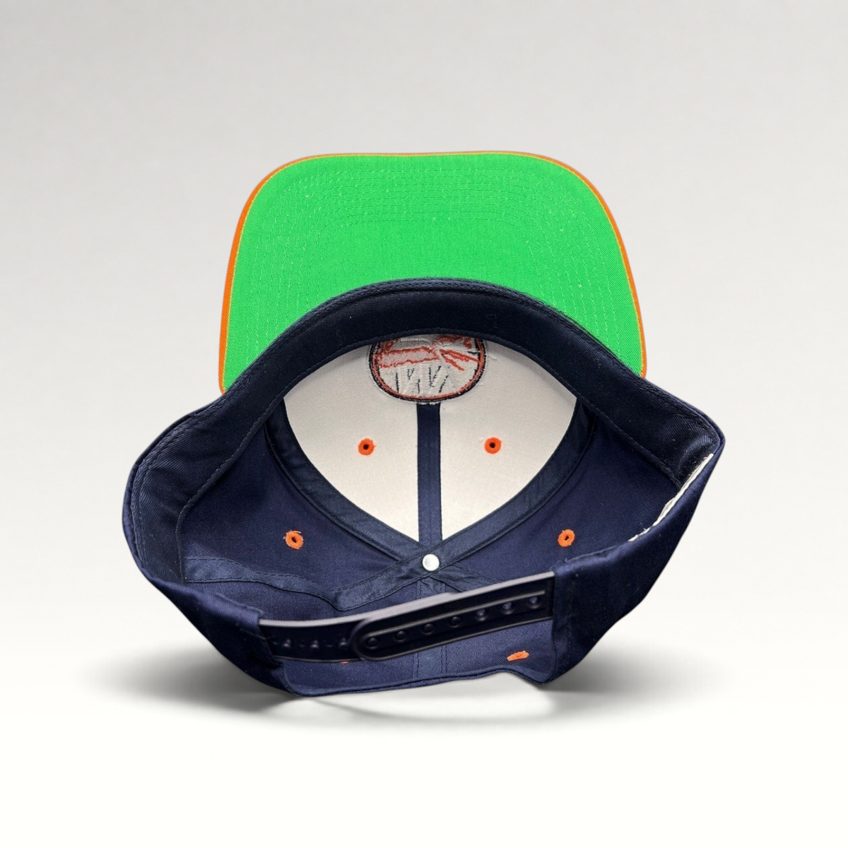 Raree Finds vintage New York Islanders snapback hat with navy crown, orange brim, and classic green undervisor.