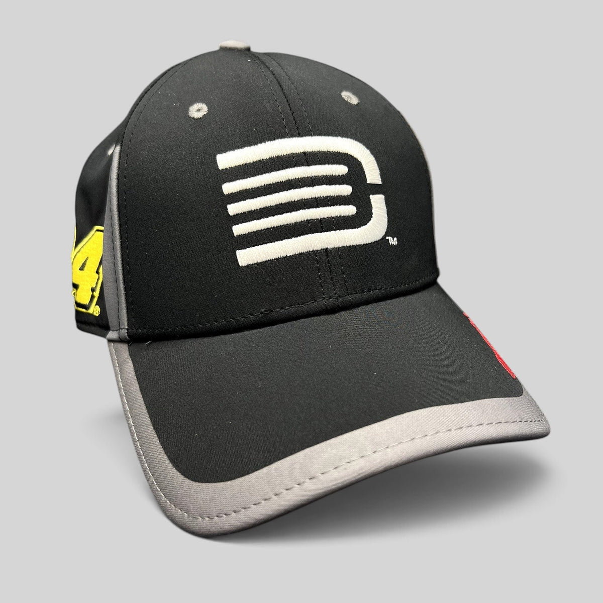 Raree Finds Jeff Gordon NASCAR A-Flex stretch hat in black and gray with a white stylized G logo and side embroidery.