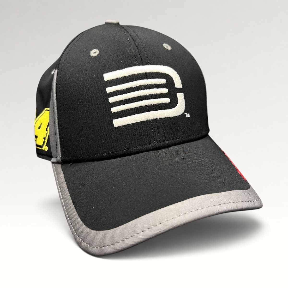 Raree Finds Jeff Gordon NASCAR A-Flex stretch hat in black and gray with a white stylized G logo and side embroidery.