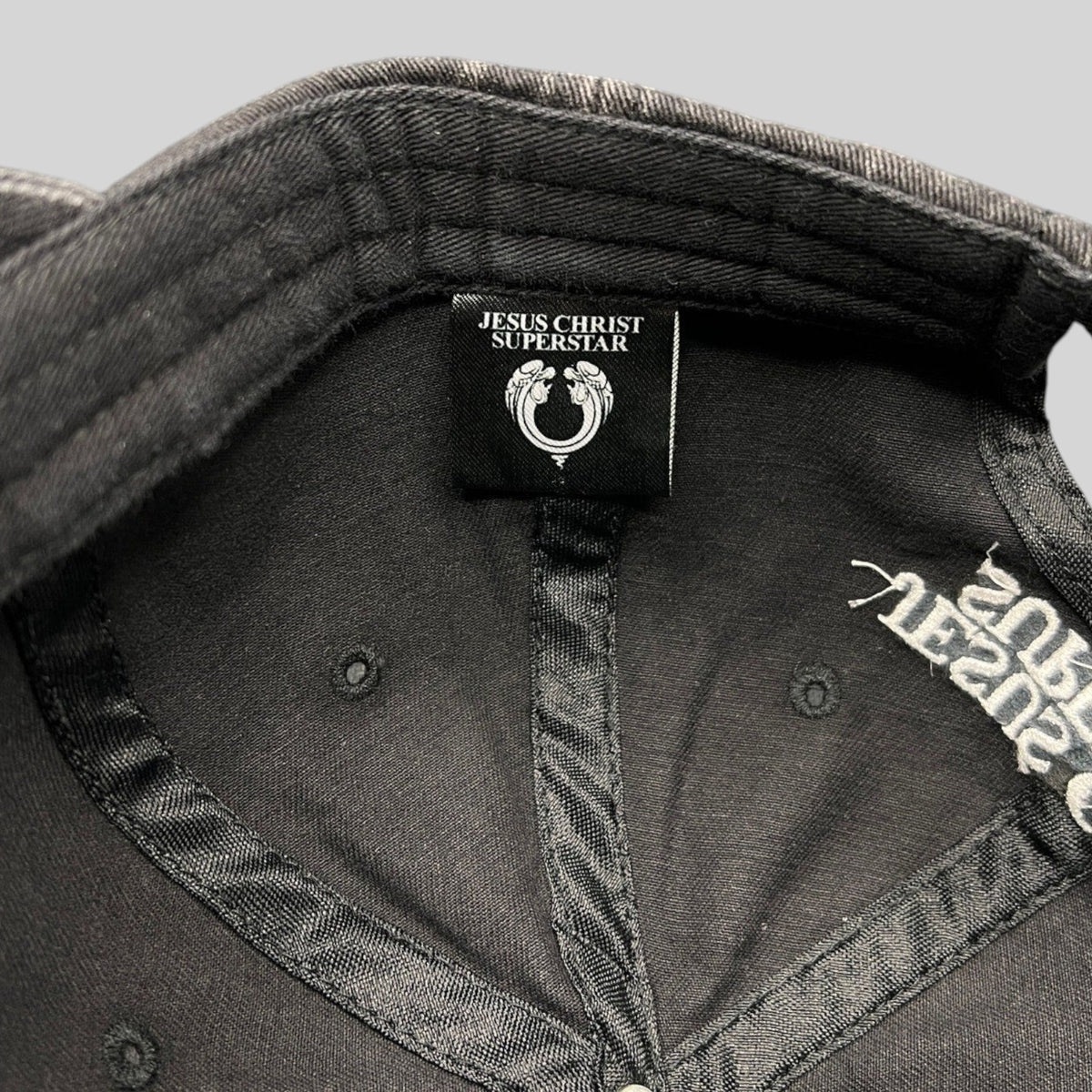 Raree Finds vintage Jesus Christ Superstar dad hat interior label and embroidered branding on black distressed cotton