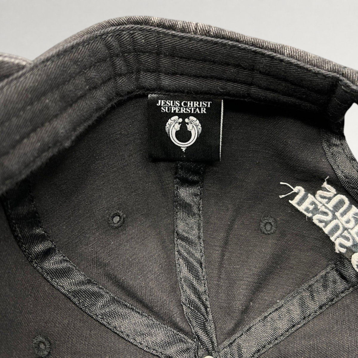 Raree Finds vintage Jesus Christ Superstar dad hat interior label and embroidered branding on black distressed cotton