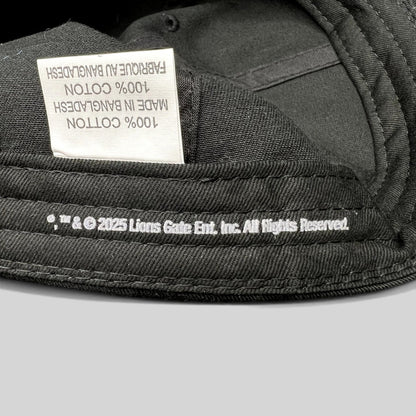 Raree Finds black cotton strapback hat interior showing 2025 Lionsgate copyright label and 100% cotton tag