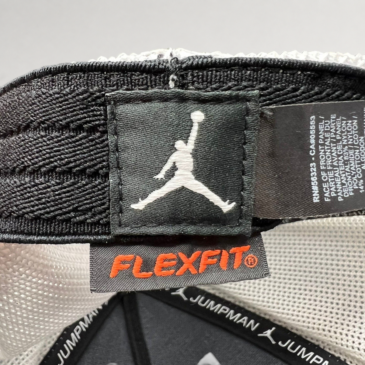 Raree Finds Jordan MJ Invitational hat interior showing Jumpman logo patch and Flexfit tag on mesh lining