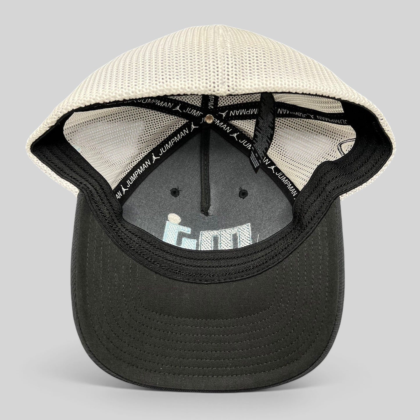 Raree Finds Michael Jordan MJ Invitational black and white mesh Flexfit golf hat, interior view showing branding.