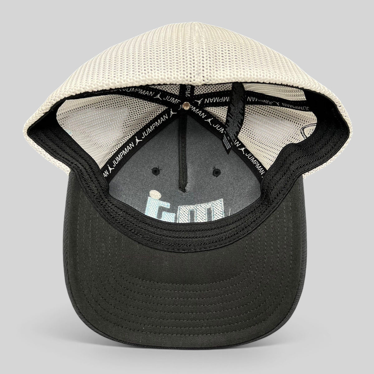 Raree Finds Michael Jordan MJ Invitational black and white mesh Flexfit golf hat, interior view showing branding.