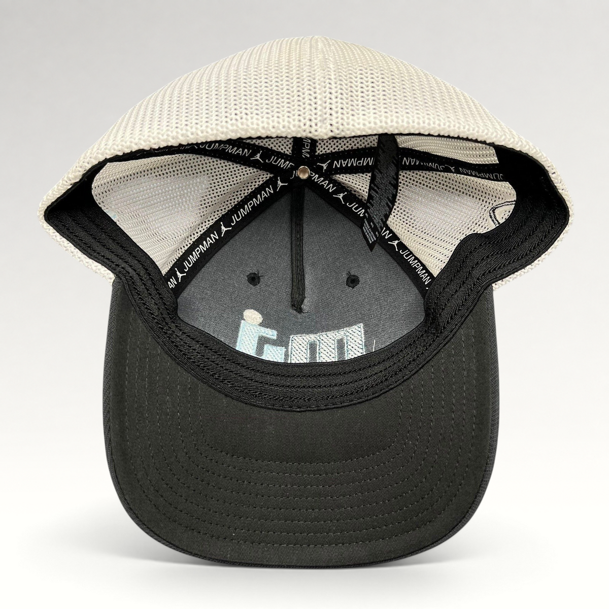 Raree Finds Michael Jordan MJ Invitational black and white mesh Flexfit golf hat, interior view showing branding.