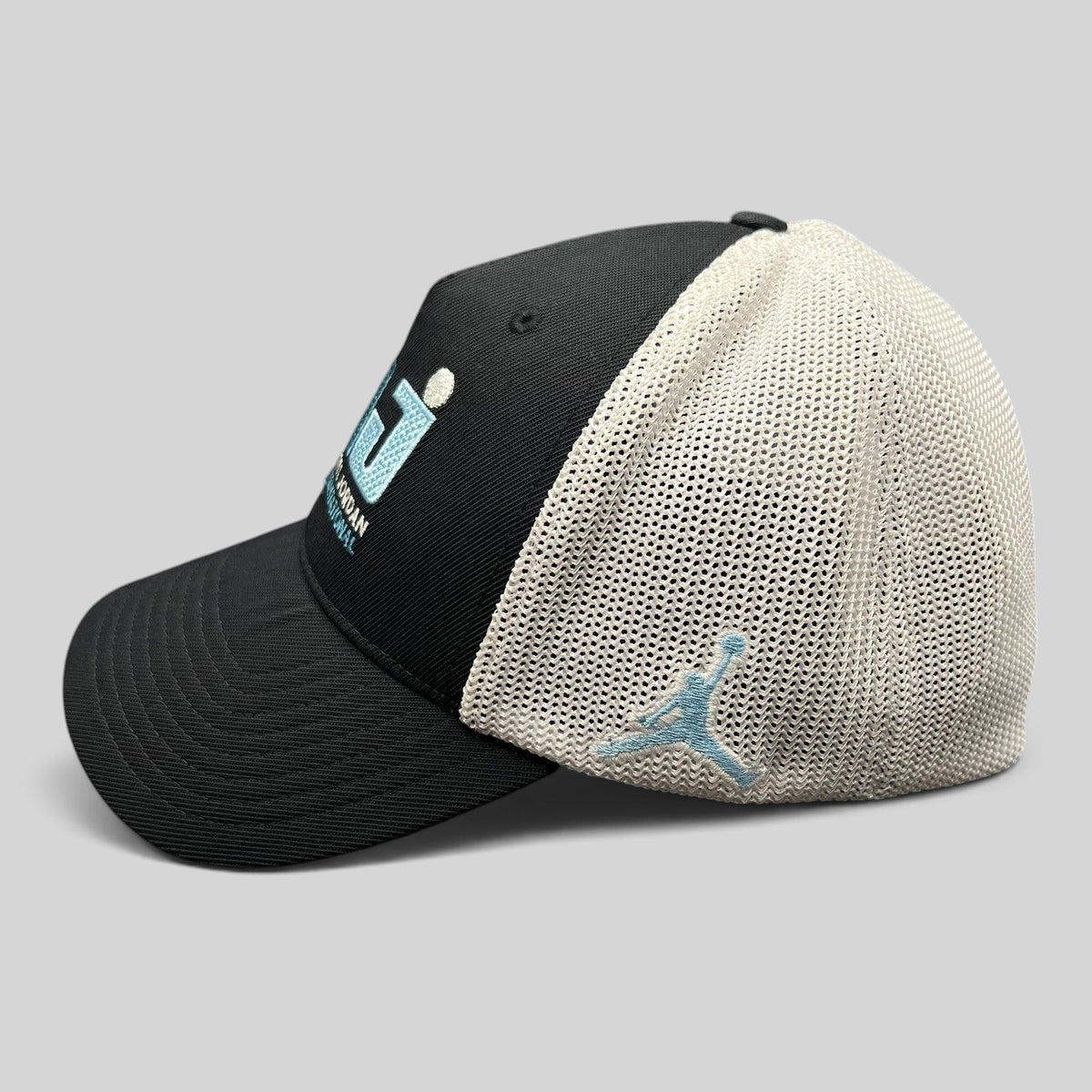 Raree Finds black and white Jordan MJ Invitational mesh back golf hat with embroidered Jumpman logo side view