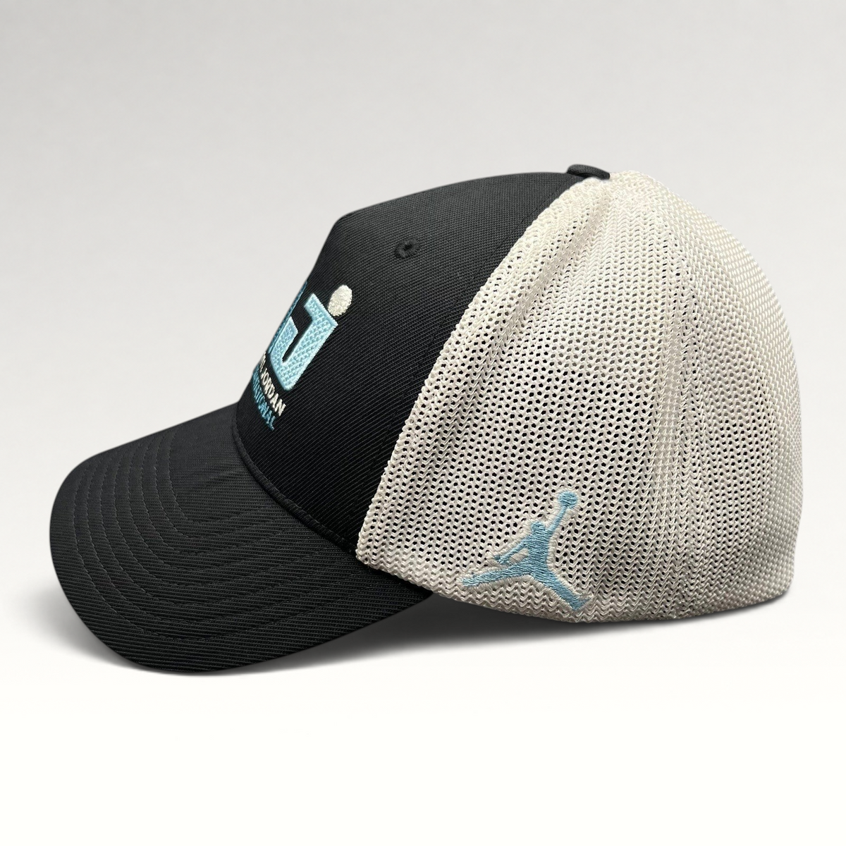 Raree Finds black and white Jordan MJ Invitational mesh back golf hat with embroidered Jumpman logo side view