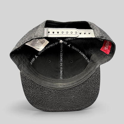 Raree Finds youth Jordan snapback hat interior view showing adjustable strap and elephant print pattern on the brim