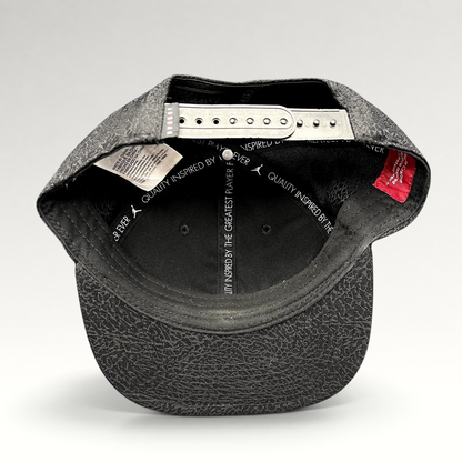 Raree Finds youth Jordan snapback hat interior view showing adjustable strap and elephant print pattern on the brim