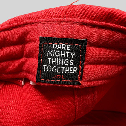 Raree Finds JPL NASA snapback hat interior label with Dare Mighty Things Together slogan stitched in red fabric
