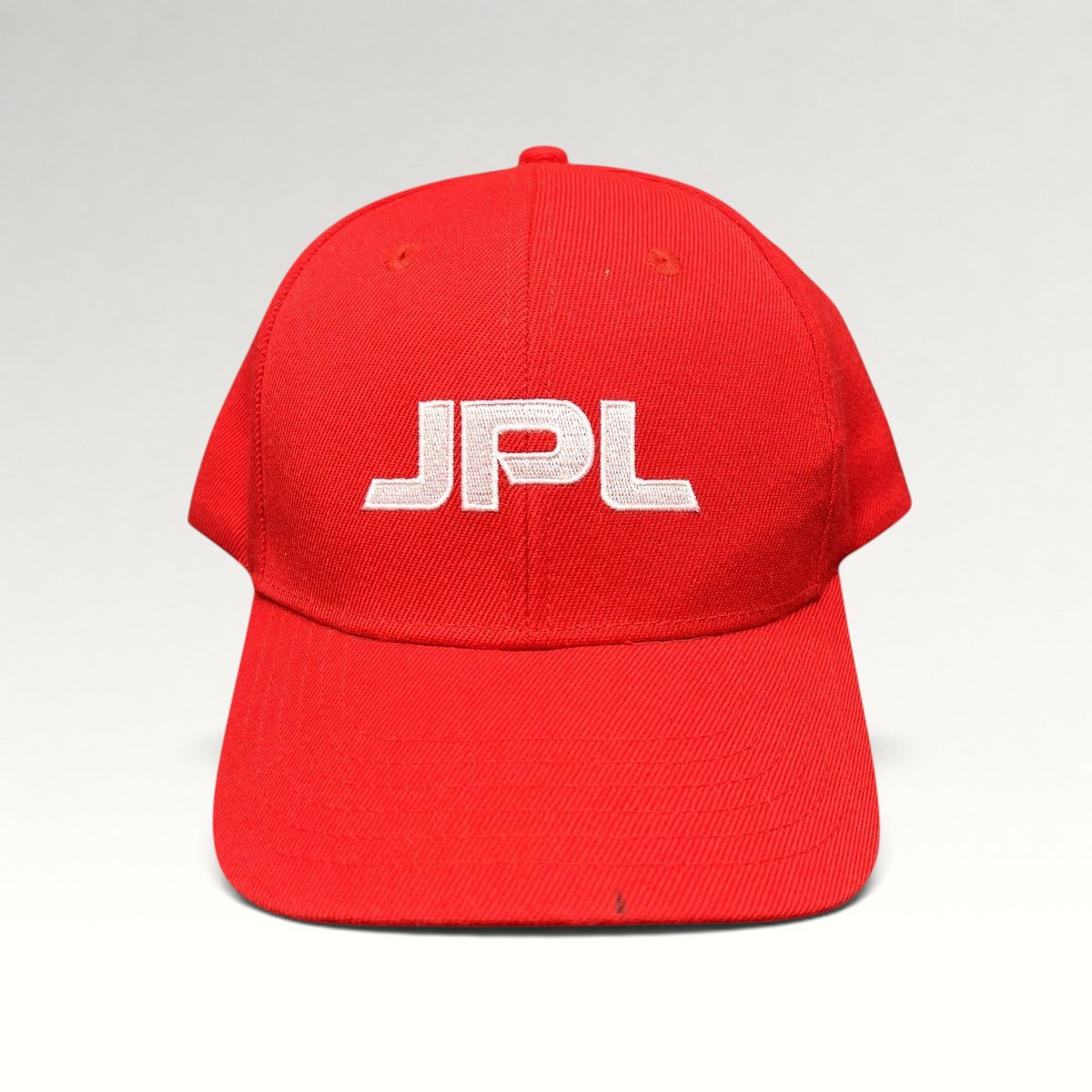 Raree Finds red JPL snapback hat with white embroidered logo on the front crown