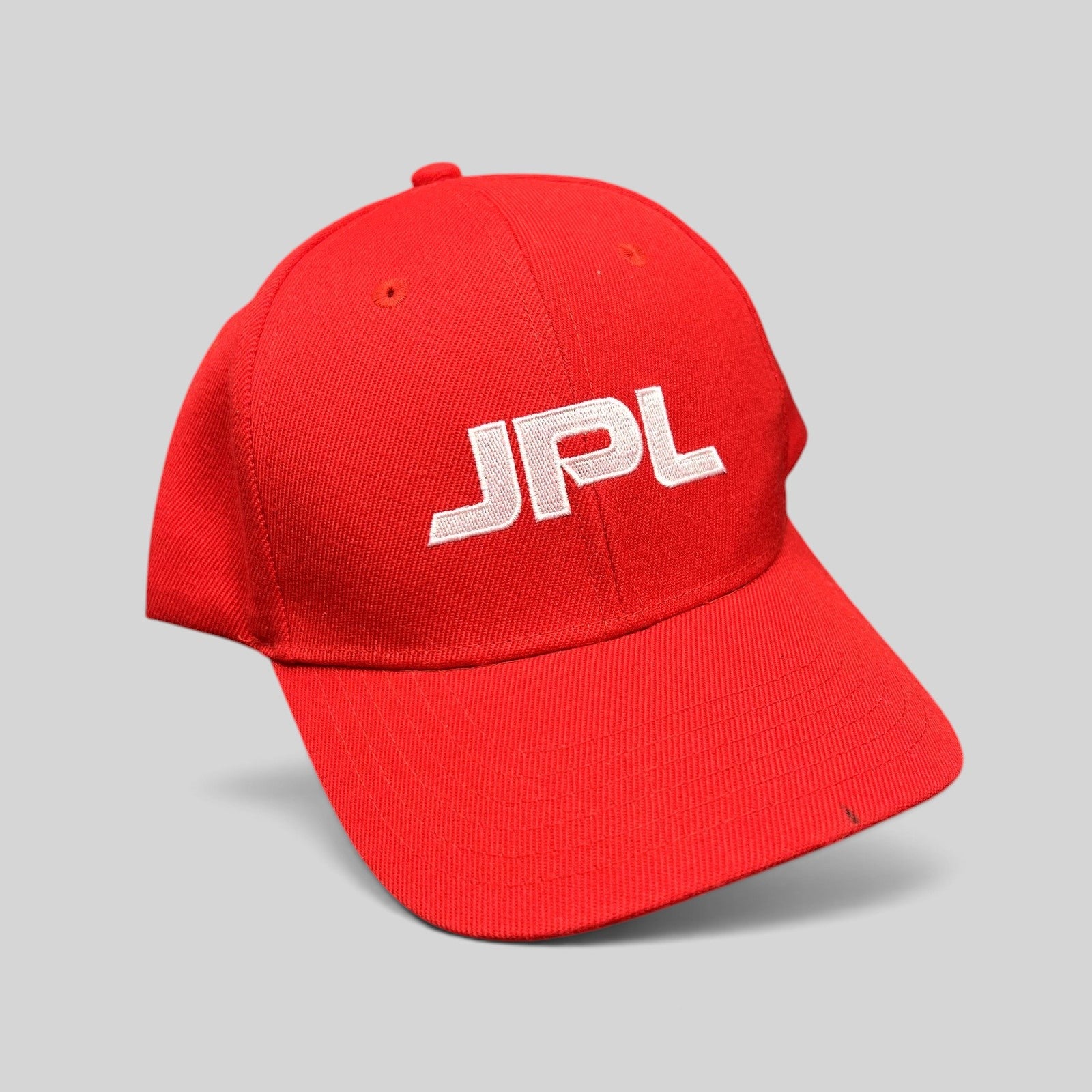 Raree Finds red JPL NASA snapback hat with white embroidered lettering on a structured crown