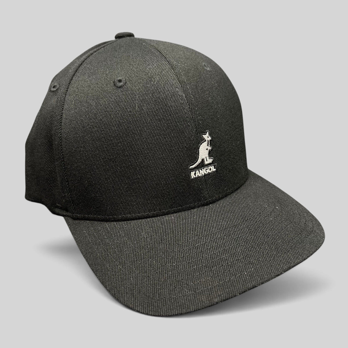 Raree Finds Kangol black flexfit baseball cap with white embroidered kangaroo logo on a structured crown
