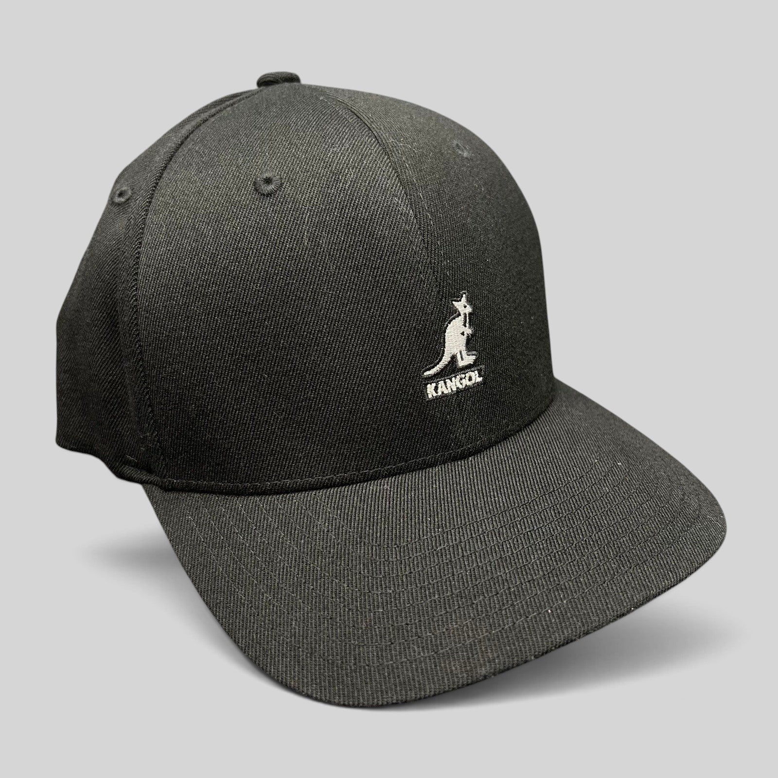 Raree Finds Kangol black flexfit baseball cap with white embroidered kangaroo logo on a structured crown