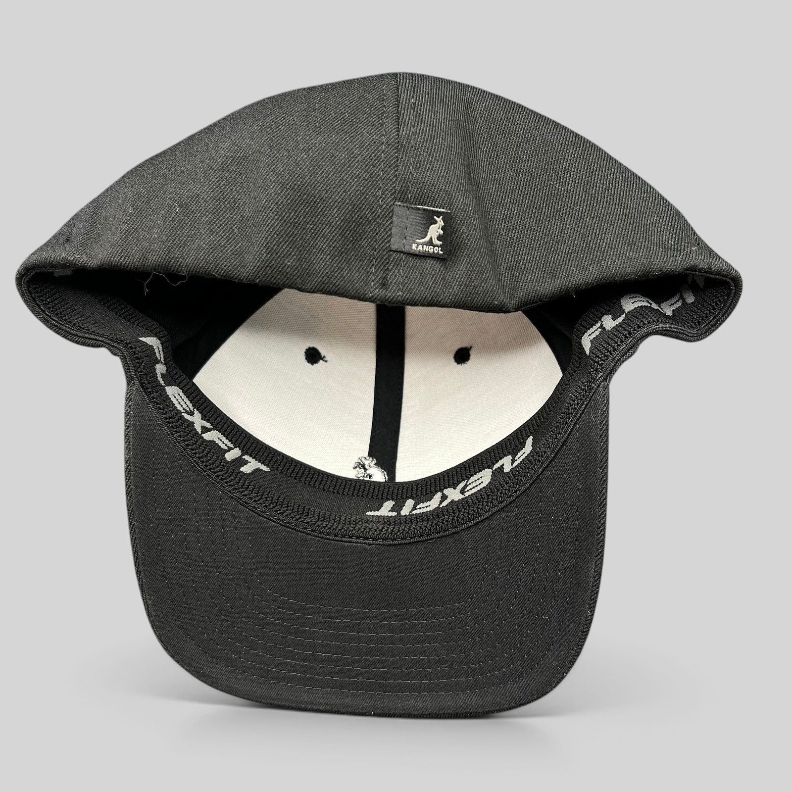 Raree Finds Kangol black flexfit baseball cap with white embroidered kangaroo logo and interior stretch band