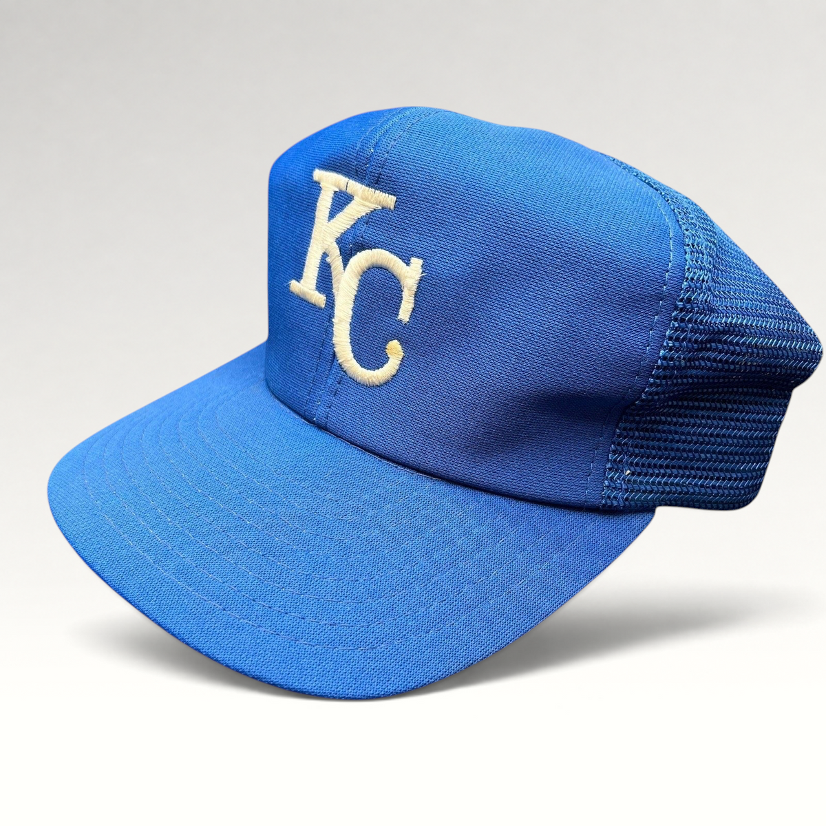 Raree Finds vintage Kansas City Royals trucker hat in royal blue with off-white KC embroidery and mesh back panels