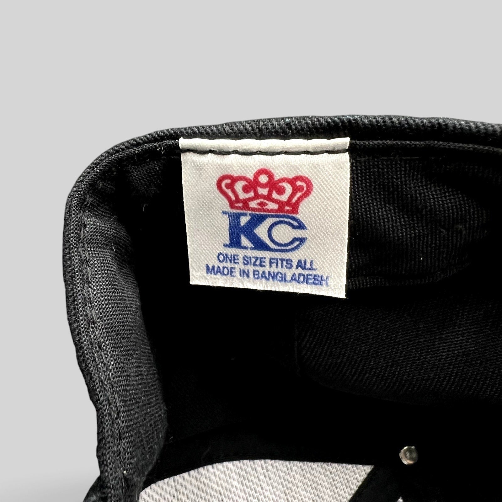 Raree Finds KC Headwear black snapback hat interior label showing crown logo and manufacturing details