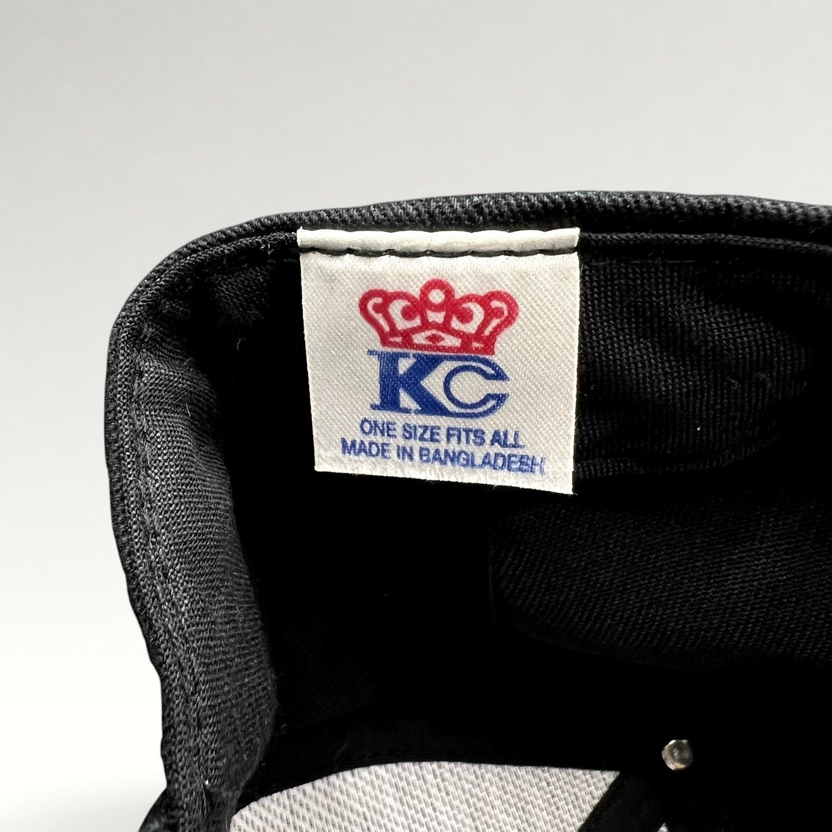 Raree Finds KC Headwear black snapback hat interior label showing crown logo and manufacturing details