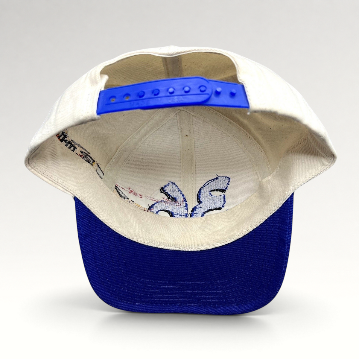 Raree Finds vintage Ken Schrader #36 NASCAR snapback hat showing the interior cream crown and blue adjustable closure.