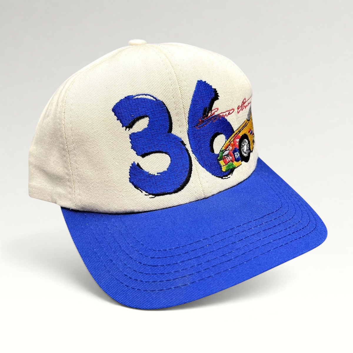Raree Finds vintage Ken Schrader #36 NASCAR snapback hat with cream crown, royal blue brim, and racing embroidery.