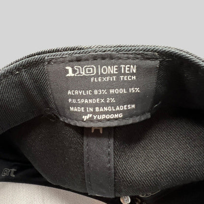 Raree Finds Kenichi Fishing hat interior tag showing Yupoong Flexfit 110 technology and material composition