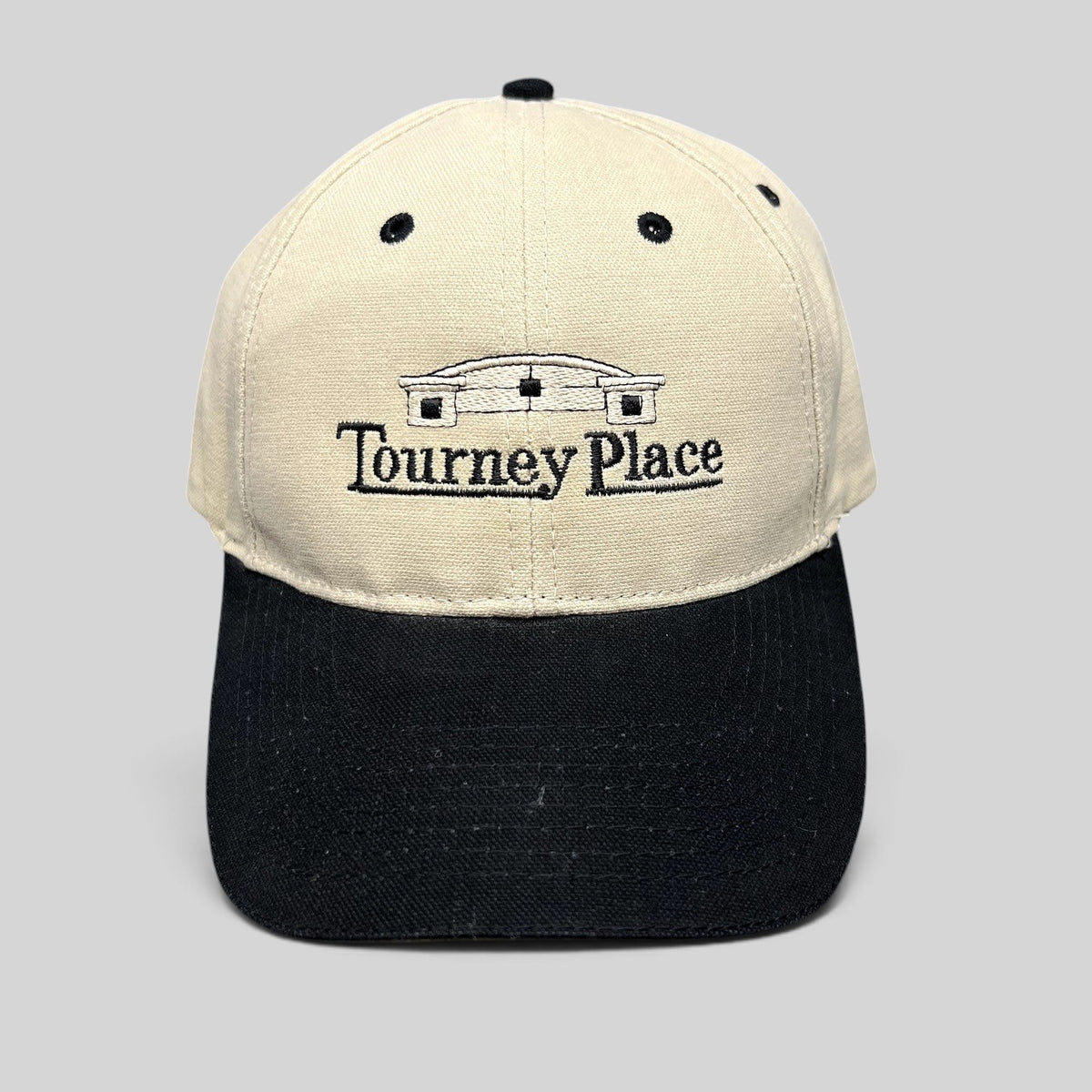 Raree Finds two-tone khaki and black cotton dad hat with embroidered Tourney Place clubhouse logo and curved brim.