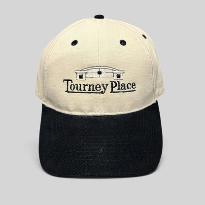 Raree Finds two-tone khaki and black cotton dad hat with embroidered Tourney Place clubhouse logo and curved brim.