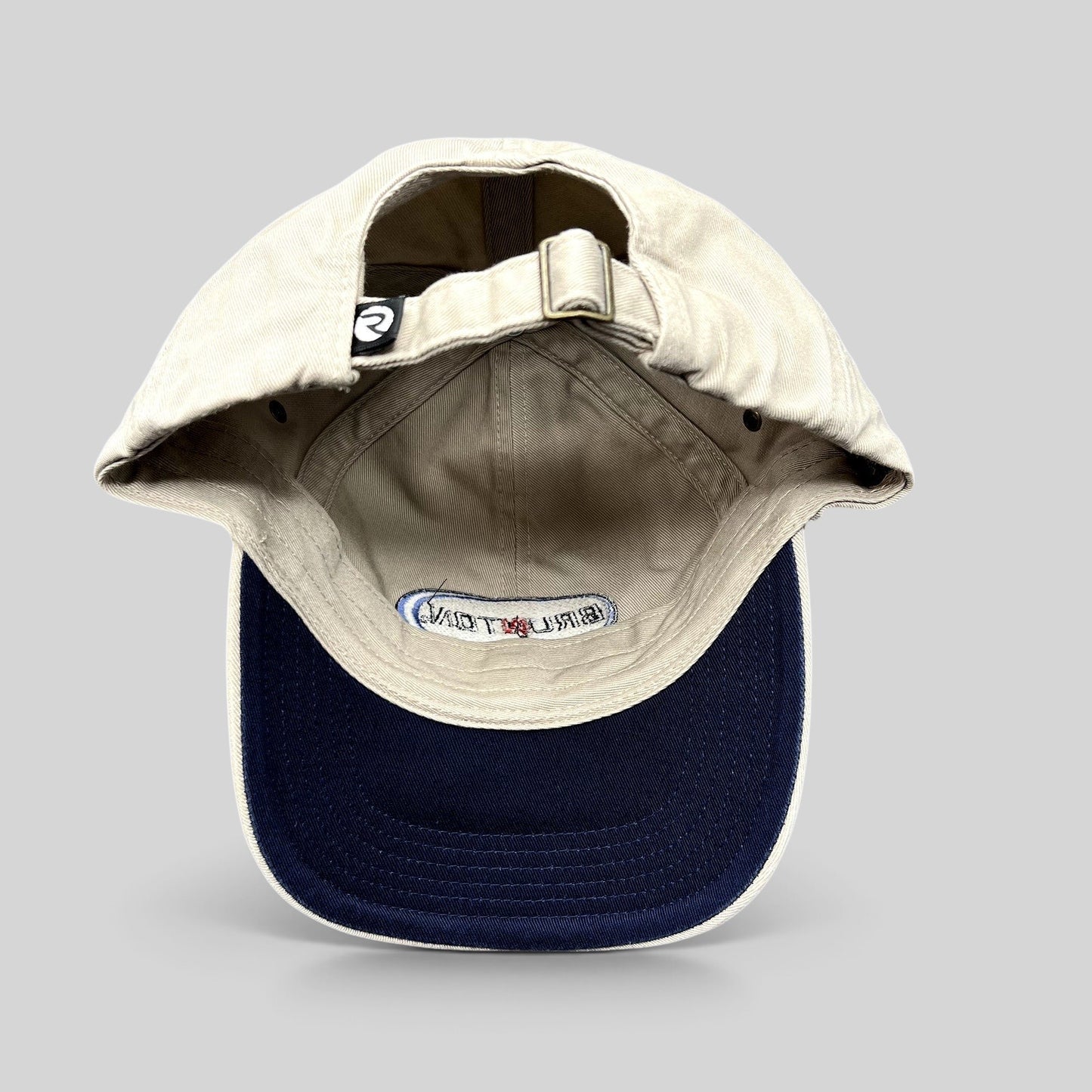Raree Finds vintage khaki cotton Richardson strapback hat with navy underbrim and interior Brunton logo embroidery