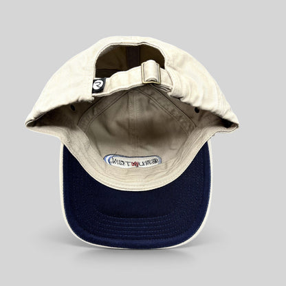 Raree Finds vintage khaki cotton Richardson strapback hat with navy underbrim and interior Brunton logo embroidery