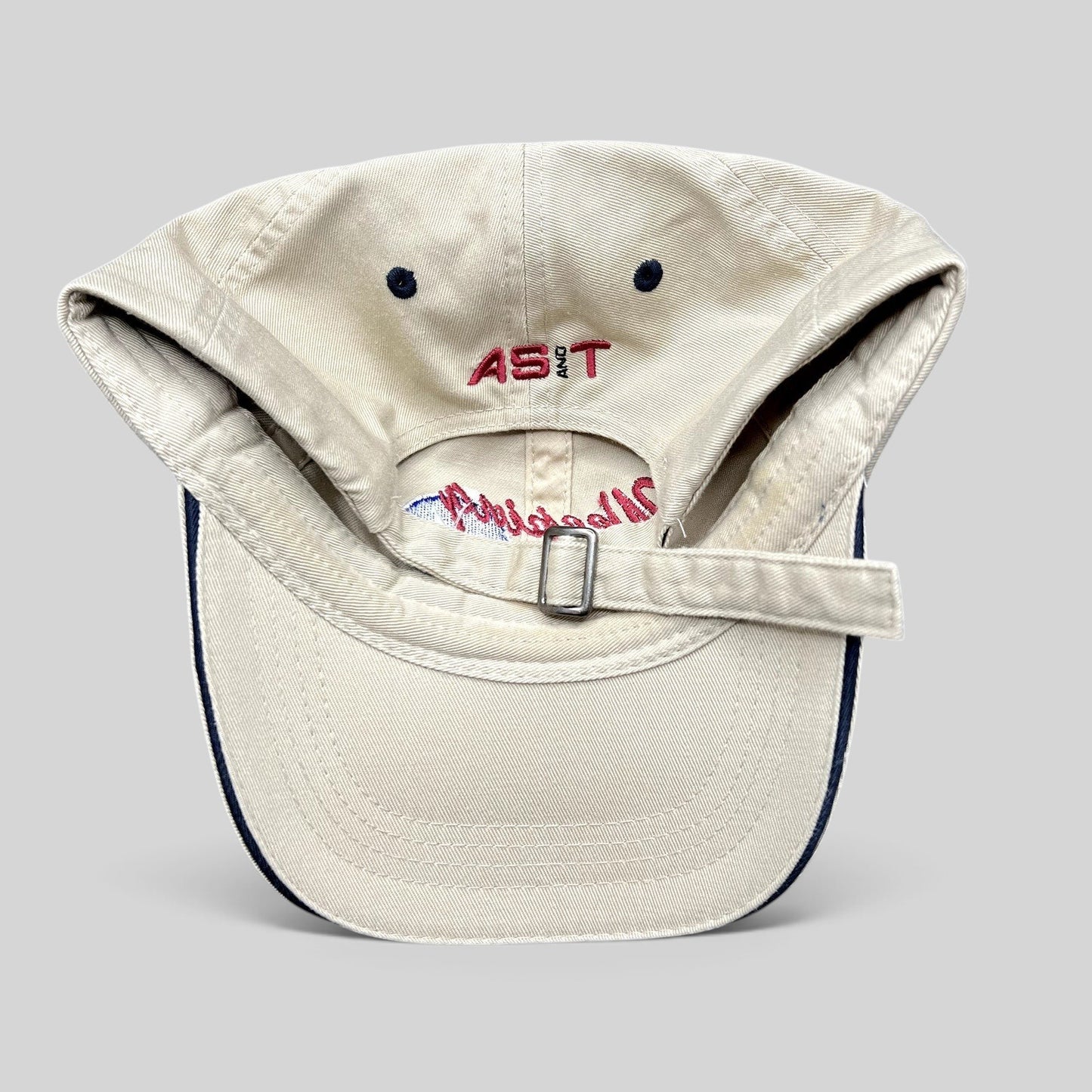 Raree Finds vintage khaki cotton strapback hat with AS&T embroidery on the back and adjustable metal buckle closure.