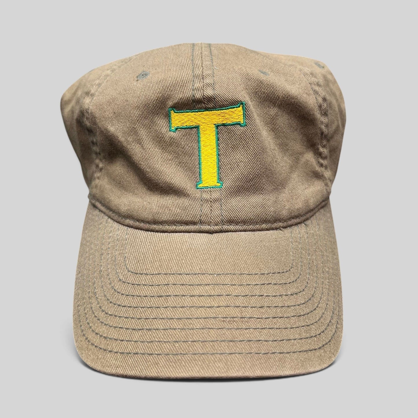 Raree Finds vintage khaki cotton twill Flexfit cap with a yellow and green embroidered T logo on the front