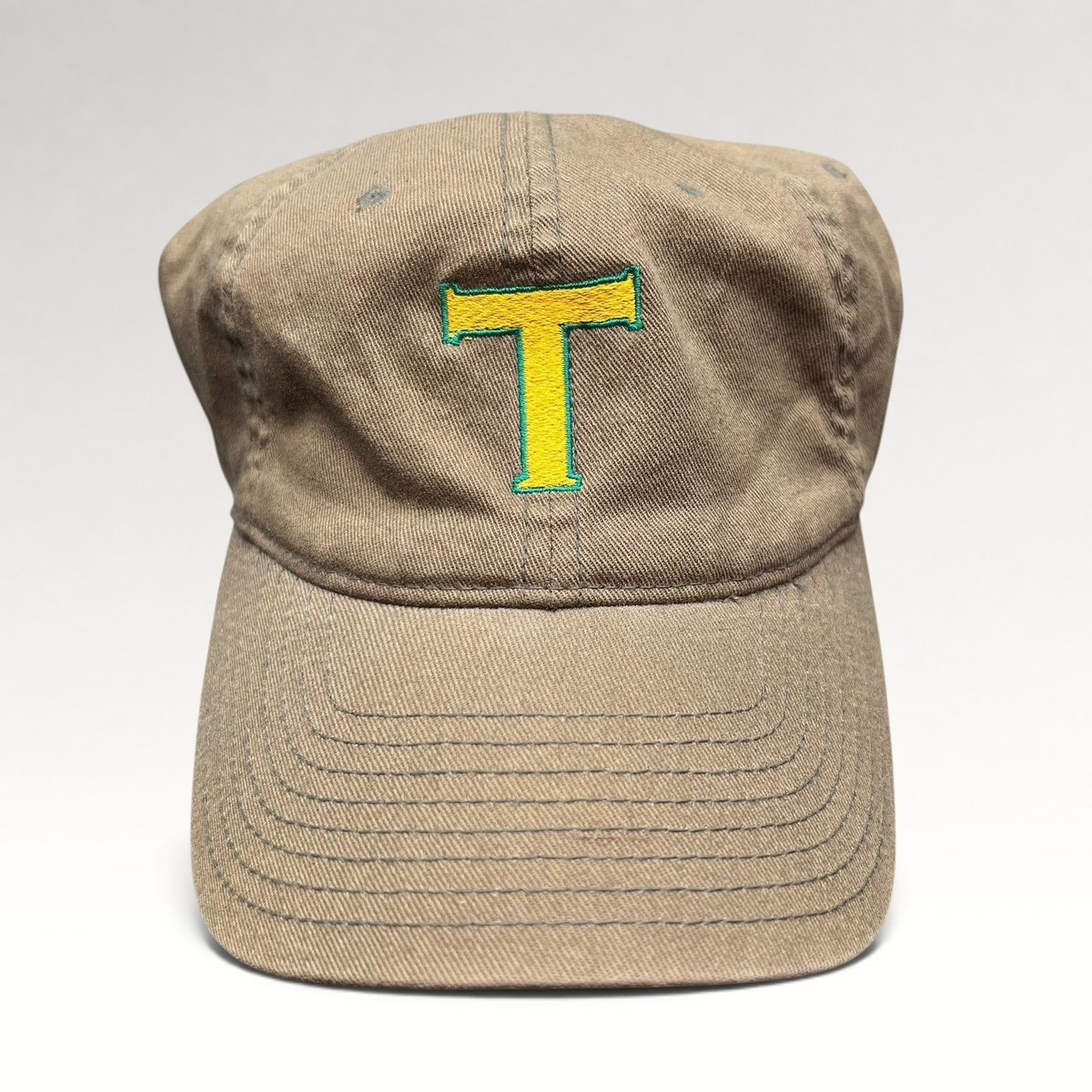 Raree Finds vintage khaki cotton twill Flexfit cap with a yellow and green embroidered T logo on the front
