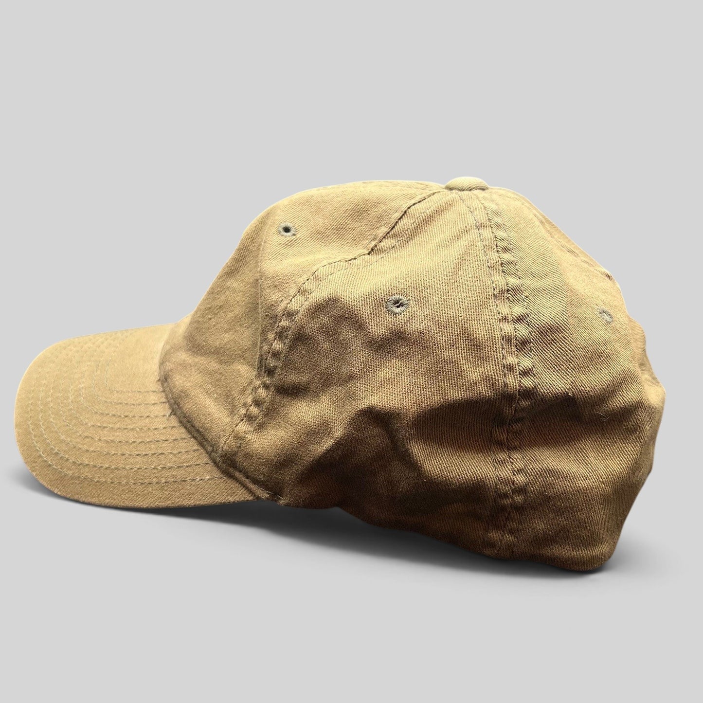 Raree Finds khaki cotton twill Flexfit cap with a six-panel design and curved bill, side profile view.