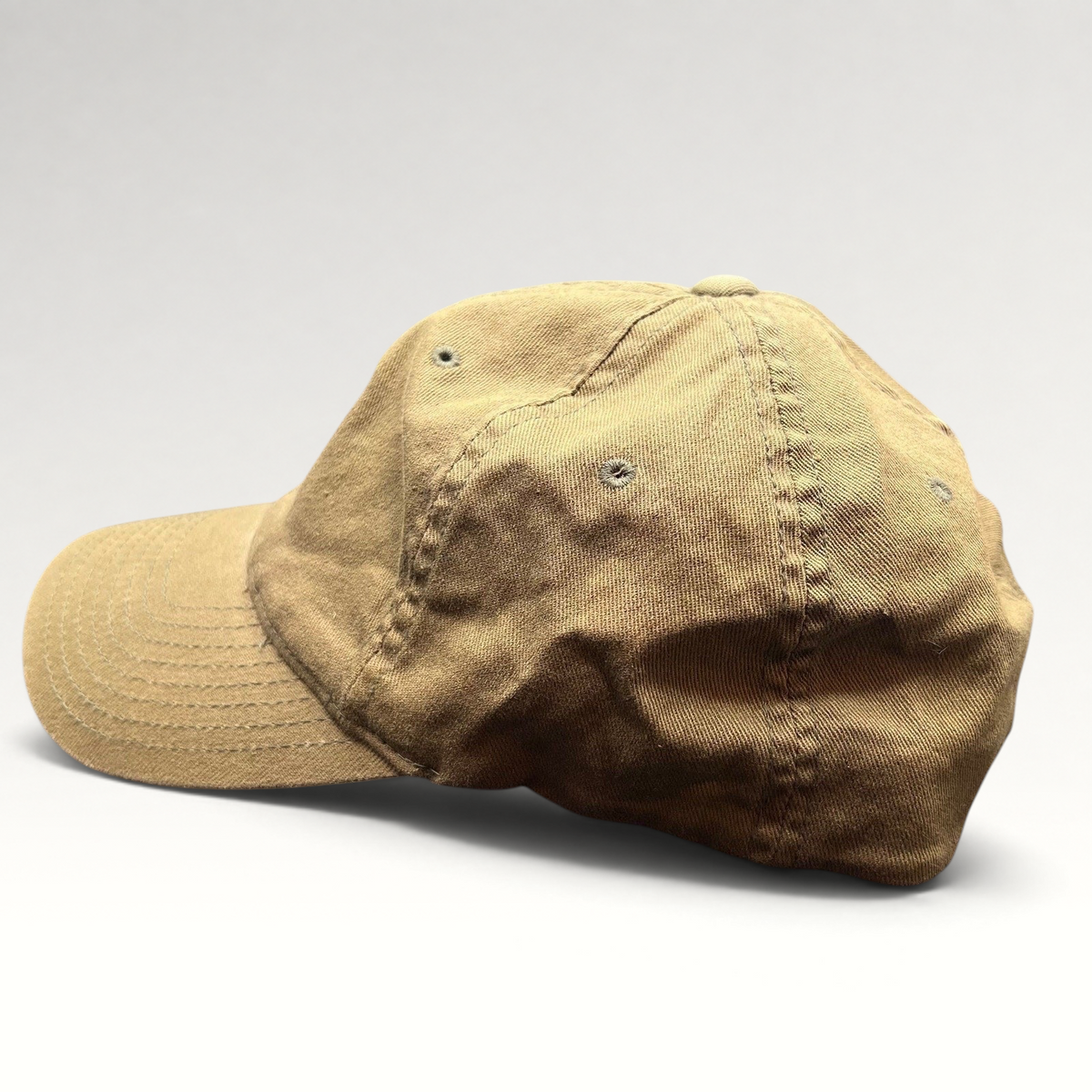 Raree Finds khaki cotton twill Flexfit cap with a six-panel design and curved bill, side profile view.