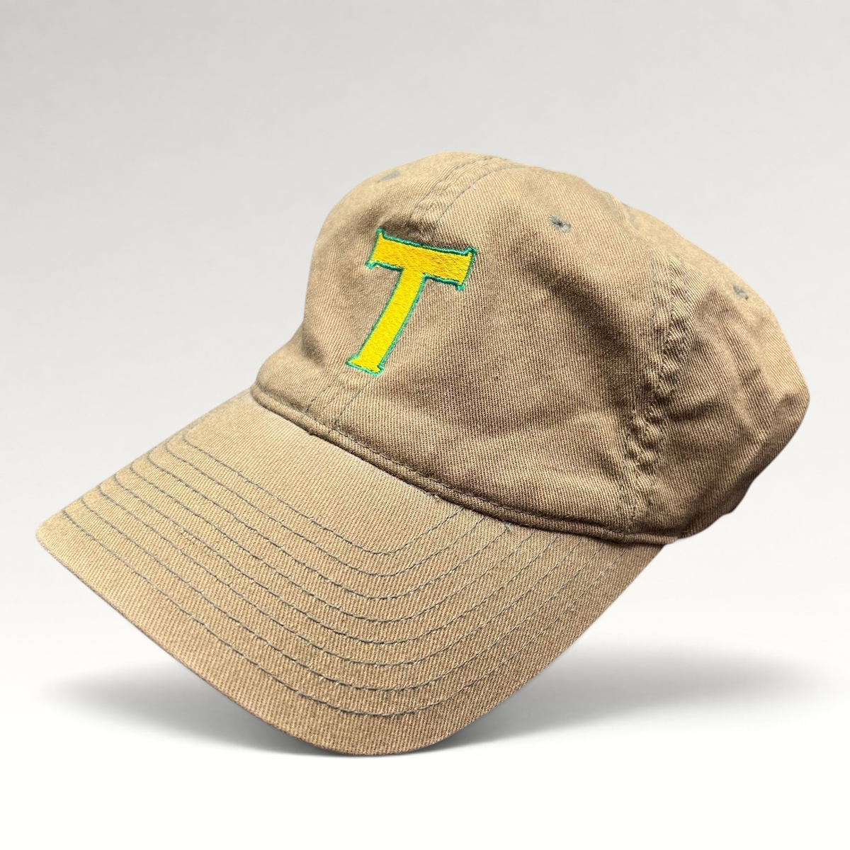 Raree Finds khaki cotton twill Flexfit hat with a yellow and green embroidered T logo on the front