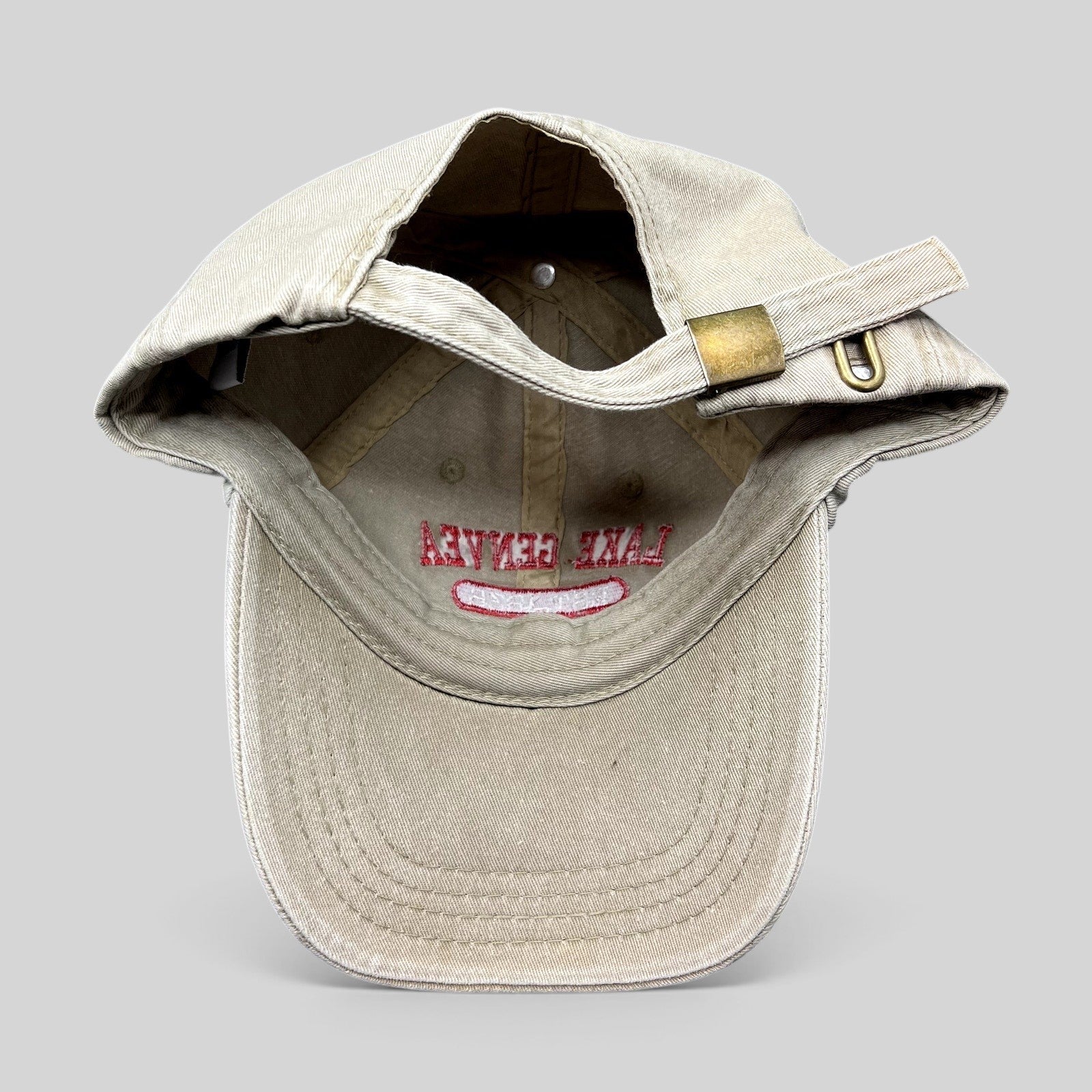 Raree Finds vintage khaki cotton strapback hat with Lake Geneva Wisconsin embroidery and adjustable brass buckle