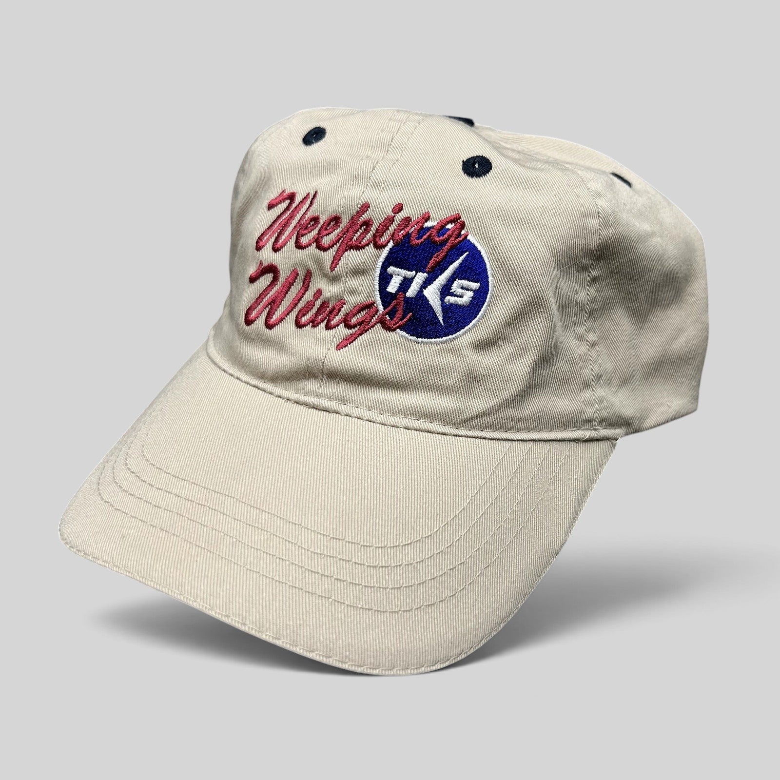 Raree Finds vintage khaki cotton Otto strapback hat with embroidered Weeping Wing TKS aviation logo on the front.