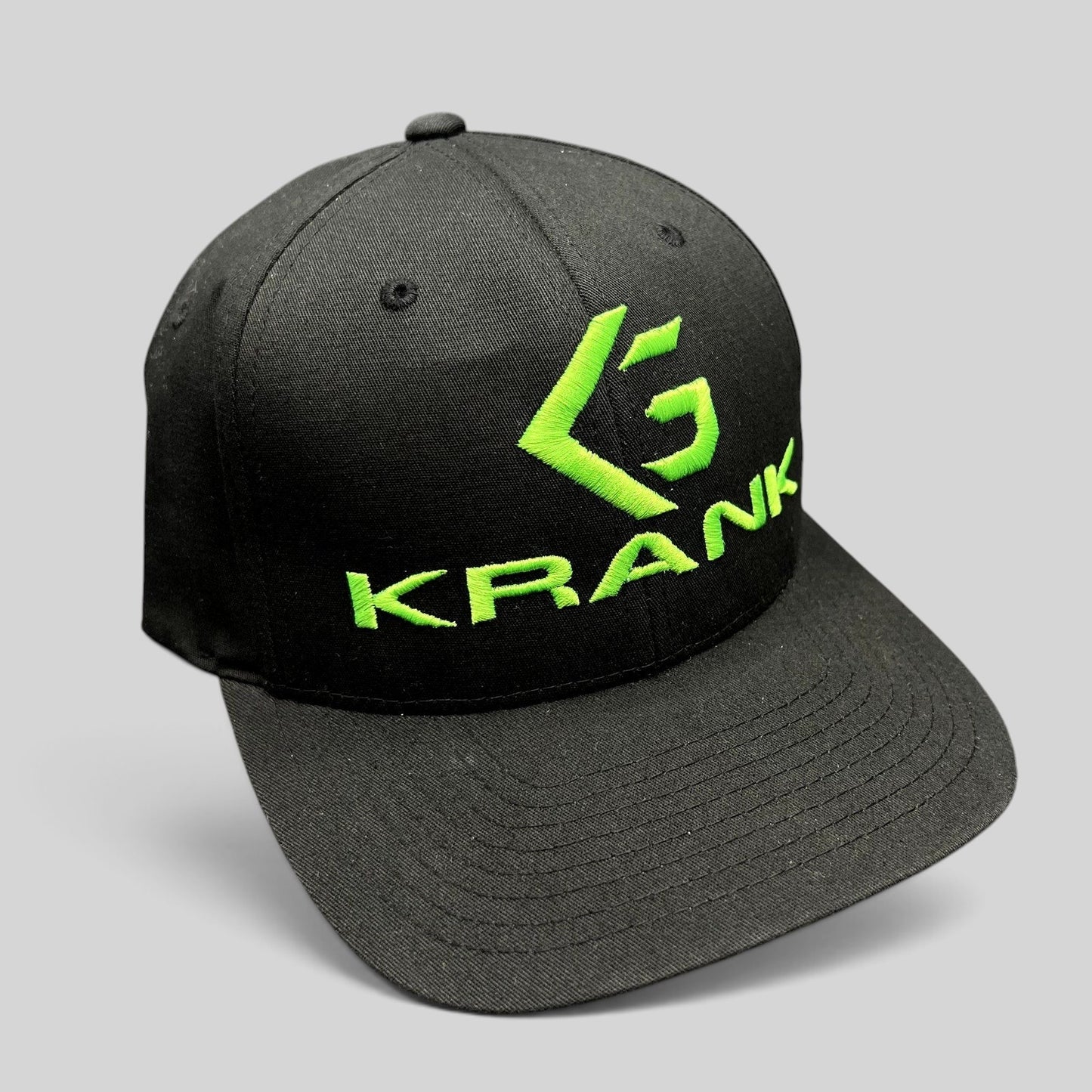Raree Finds black Krank Golf Flexfit hat with bright green embroidered logo on the front
