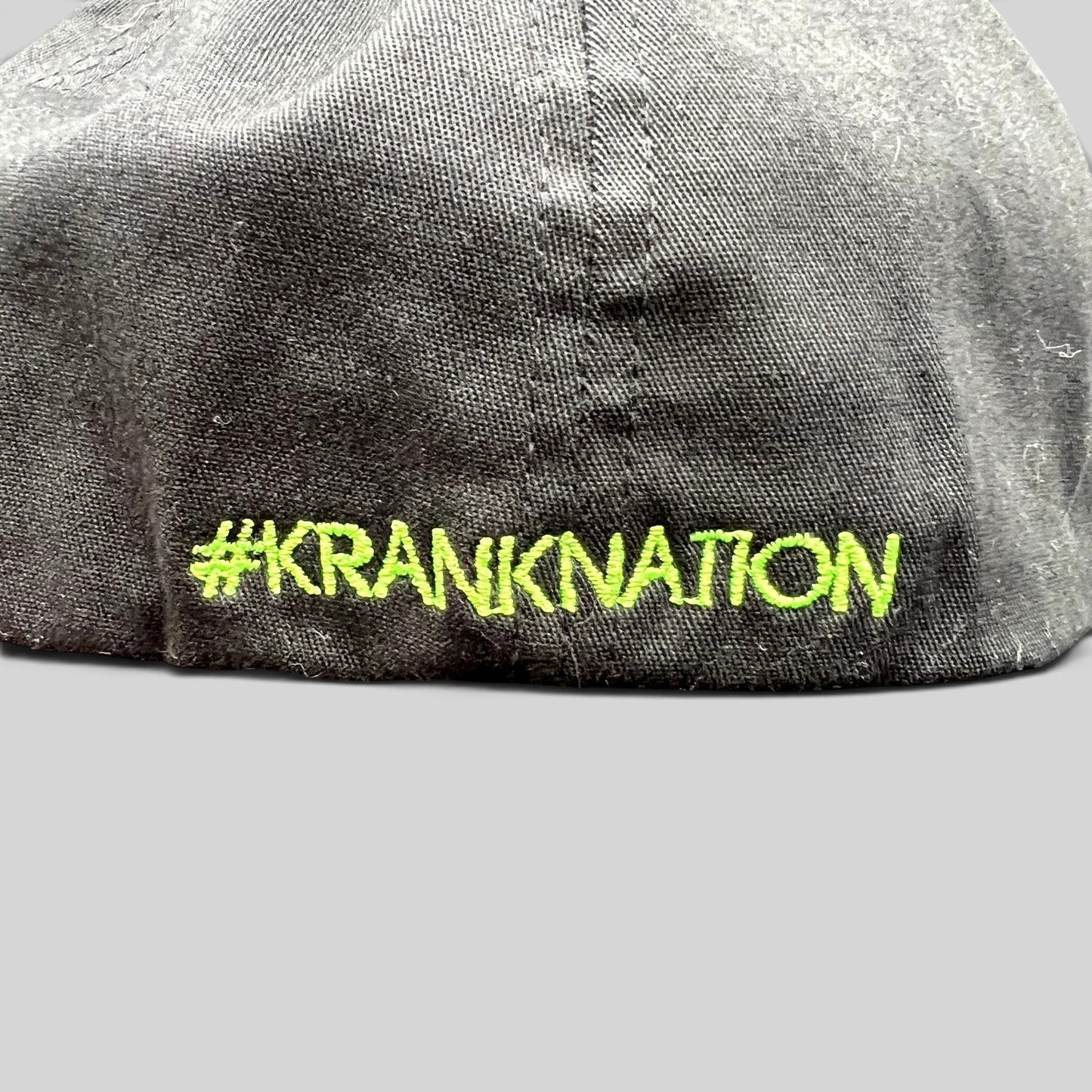 Raree Finds black Krank Golf Flexfit hat featuring bright green #KrankNation embroidery on the back