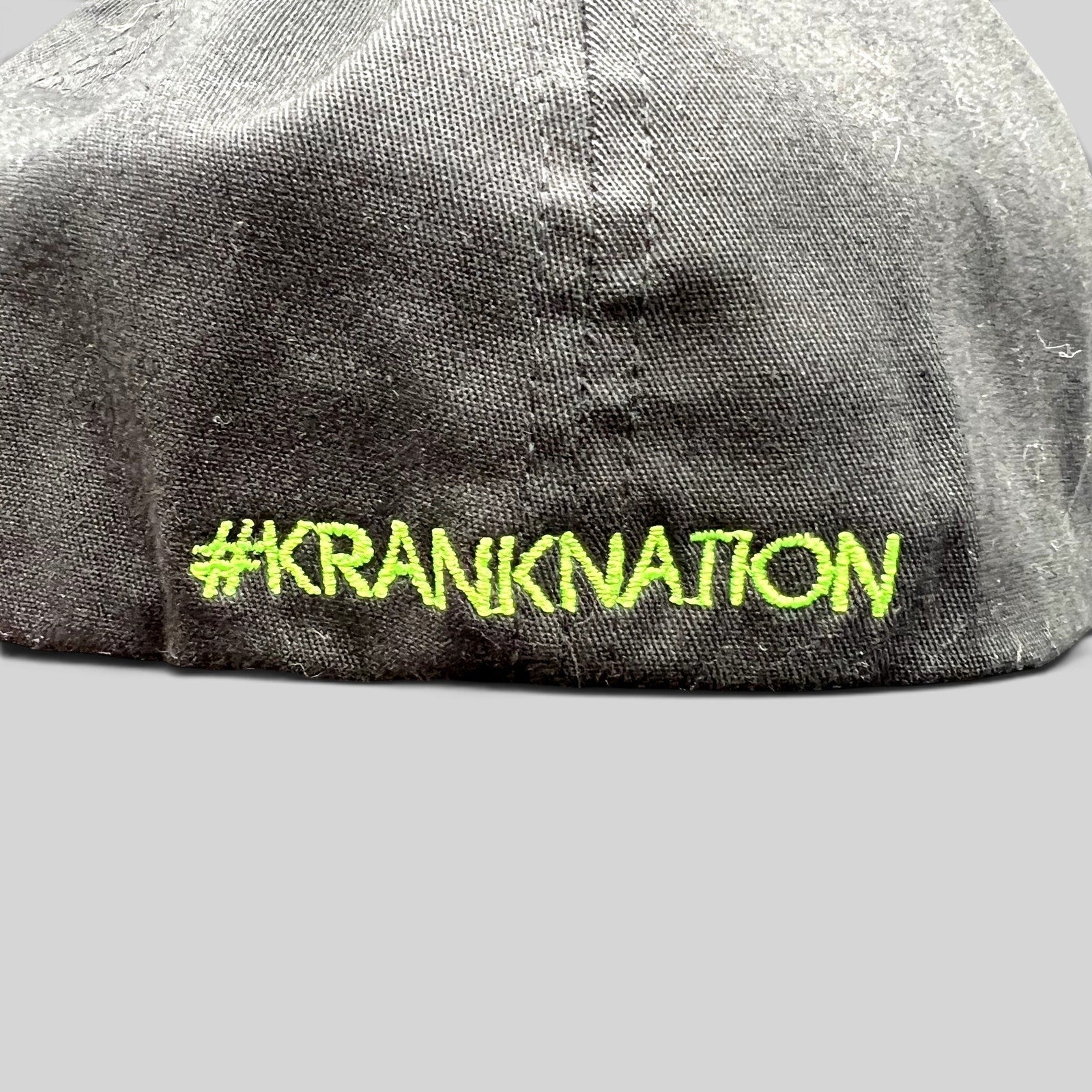 Raree Finds black Krank Golf Flexfit hat featuring bright green #KrankNation embroidery on the back